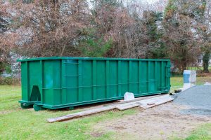Debris container, construction rubbish bin with loads at waste garbage bricks and material from demolished house